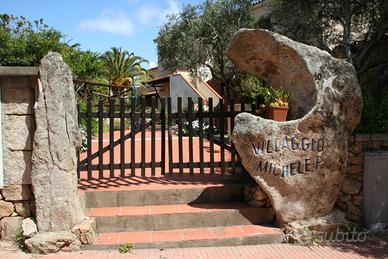 Cannigione appartamento con giardino