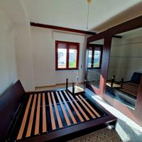 Camera matrimoniale con letto contenitore, armadio