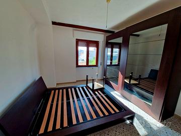 Camera matrimoniale con letto contenitore, armadio