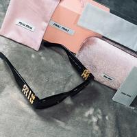 Occhiali Miu Miu SMU11W Neri con dettagli Oro