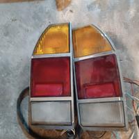 Fari posteriori, borchie e volante 124 sport