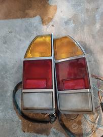 Fari posteriori, borchie e volante 124 sport