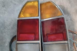 Fari posteriori, borchie e volante 124 sport