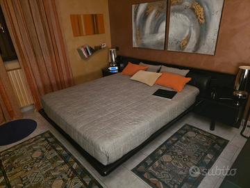 Camera da letto elegante e moderna