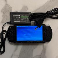 Psp nera funzionante con cavo di ricarica e gioco