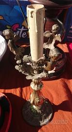 Antico candelabro in ottone con putti del '900
