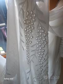 coppia tendoni bianchi ricamati 