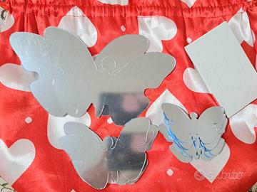 specchi a forma di farfalle