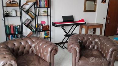 Coppia di poltrone Chesterfield vintage vera pelle