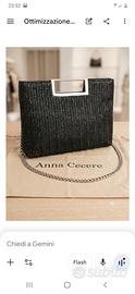 Borsa pochette in rafia nera