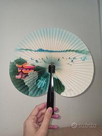 Ventaglio circolare vintage in carta casa e alberi