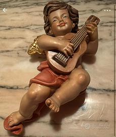 Angelo musicante in legno da parete con chitarra