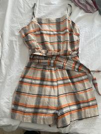 Tutina con cerniera laterale