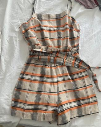 Tutina con cerniera laterale