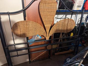 Letto in ferro battuto e vimini