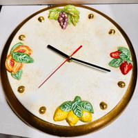 Orologio da muro in terracotta dip.a mano.