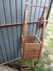 Antico scalda letto in legno.