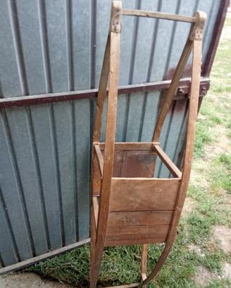 Antico scalda letto in legno.