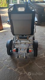 carrozzina elettrica  per in. con batteria ricar