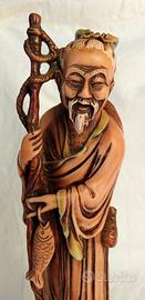 Statua anziano pescatore asiatico 