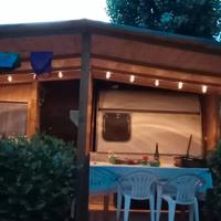 Casetta legno, roulotte e veranda