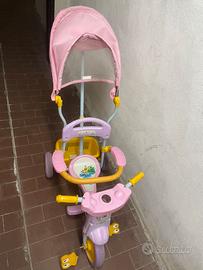 Triciclo rosa con manico
