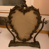 Cornice per specchio basculante