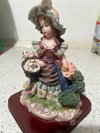 Statuetta ceramica bambina con cagnolini