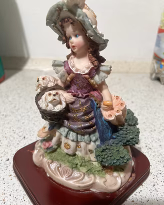 Statuetta ceramica bambina con cagnolini