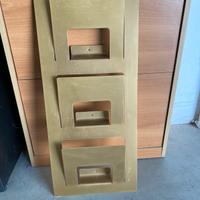 Ganci, mensole e porta rivista