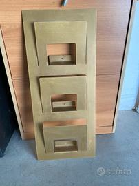 Ganci, mensole e porta rivista