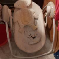 Dondolino  bambini  elettrico a batterie con music