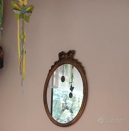 Specchio ovale con fiocco