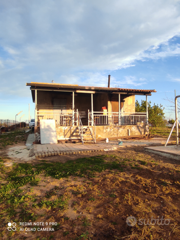 Terreno con casa