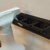 Sbarra porta-flaconi spray modulare a parete