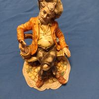 statuetta bevitore vino