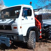 Macchina operatrice MAN 9.150 4x4 con gru