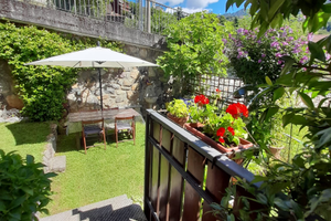 Bilocale con giardino e balconata