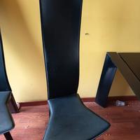 tavolo in vetro nero con set sedie 