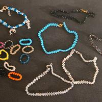 Set cavigliere, anelli e bracciale