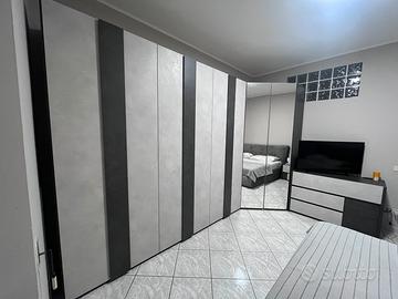Camera da letto completa e cabina armadio a angolo