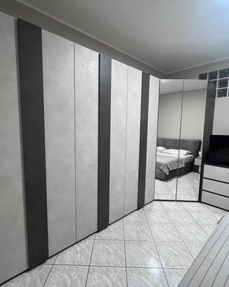 Camera da letto completa e cabina armadio a angolo