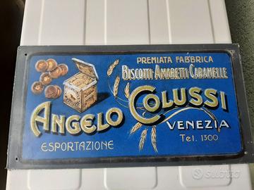 INSEGNA ANGELO COLUSSI TARGA IN RILIEVO