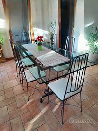 Tavolo in ferro battuto con cristallo e sei sedie 