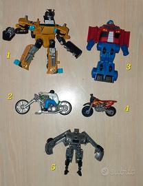 Vari giocattoli serie "Transformers e moto"