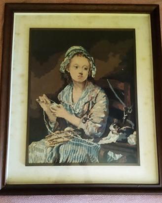 Quadro punto croce con dama che cuce 