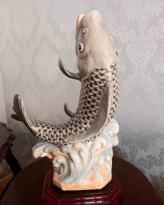 Scultura ceramica su base plexiglas RITIRO SU 