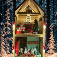 Casa di babbo natale con luci fumo e musica