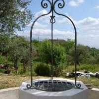 Arco e coperchio per pozzo in ferro battuto