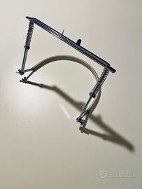 Supporto per armonica a bocca (Reggiarmonica)